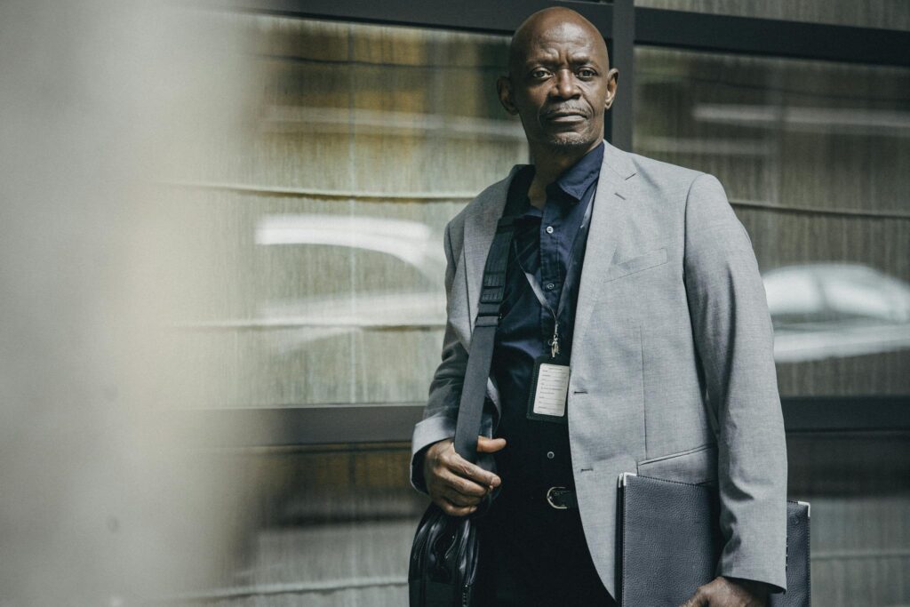 Portrait of a mature businessman exuding confidence in a modern urban setting.