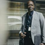 Portrait of a mature businessman exuding confidence in a modern urban setting.